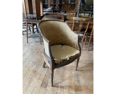 A 19th century armchair, on mahogany reeded legs
