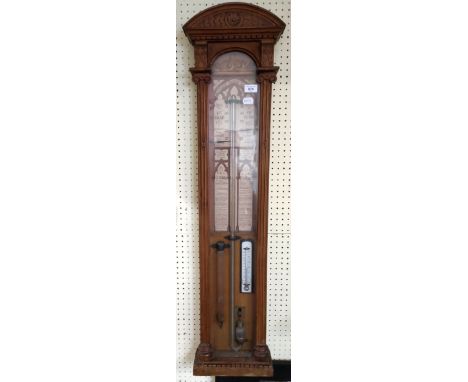 An Admiral Fitzroy barometer, in a carved oak case, 113 cm high
