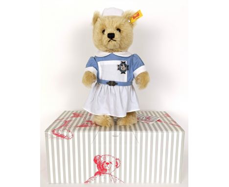 A Steiff teddy, and two dolls (box)