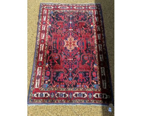 A Persian red ground rug, 210 cm x 140 cm