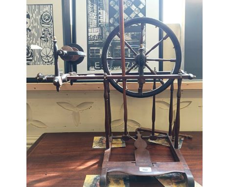 A spinning wheel, of small proportions, with carved bone mounts, 60 cm wide