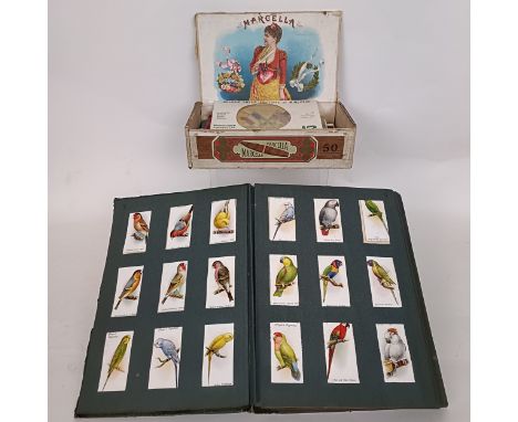 An album of postcards, an album of cigarette cards and assorted ephemera (box)