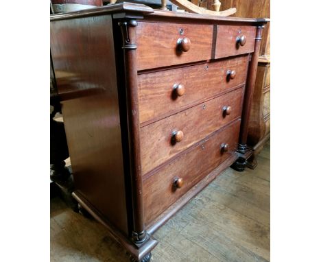 A 19th century chest, having two short and three long drawers, having column supports, 120 cm wide