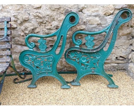 A pair of painted cast iron bench ends