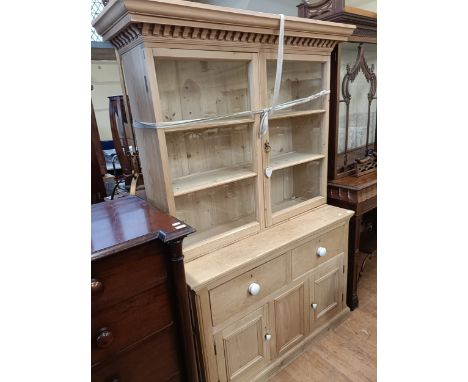 A pine dresser, with a glazed top, 128 cm wide