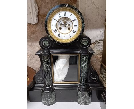 A mantel clock, the enamel dial with visible anchor escapement, to a twin train eight day movement, striking on a bell, with 