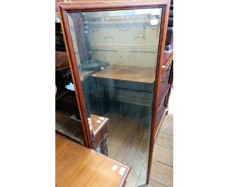 An oak framed shop type mirror with bevelled glass, 147 x 48 cm