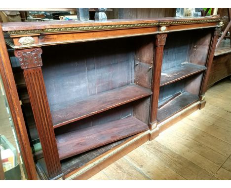 A late 19th/early 20th century mahogany library bookcase, with a leather inset top and gilt metal mounts, 110 cm high x 220 c