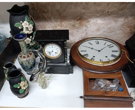 A wall clock, in a mahogany case, a mantel clock in a slate case, a set of three pottery vases decorated flowers, a Doulton v