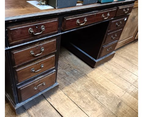 A mahogany pedestal desk, 137 cm wide, and a Pembroke table (2)