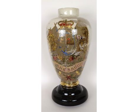A 19th century apothecary advertising jar, the interior painted a crest, various losses, lacking lid, 24 cm high