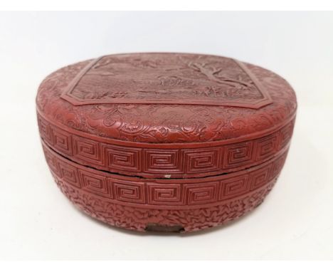 A Chinese red cinnabar lacquer box, 17 cm diameterVarious losses.