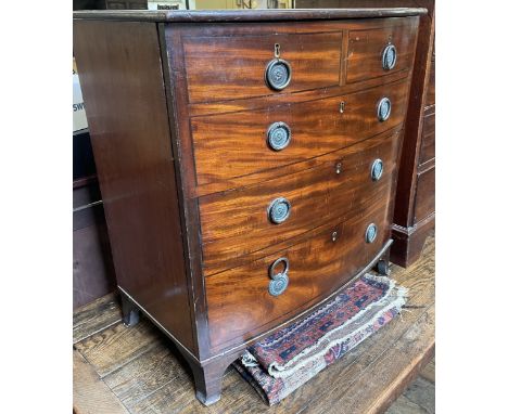 A mahogany chest, a worn red ground rug, and a standard lamp (3)