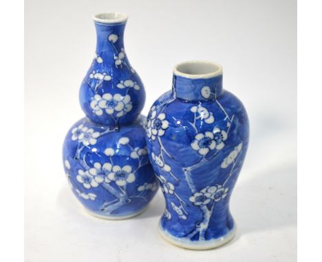 Two Chinese blue and white vases, both decorated with prunus and both with underglaze blue Kangxi four-character mark; the la