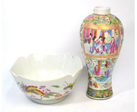 A Canton famille rose vase, decorated with typical Manchu/Chinese figures in narrative scenes, 29cm high; together with a Chi