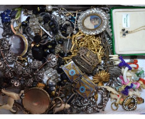 A collection of vintage jewellery including enamelled bracelet, paste set buckles, Middle Eastern buttons, dress clips, etc