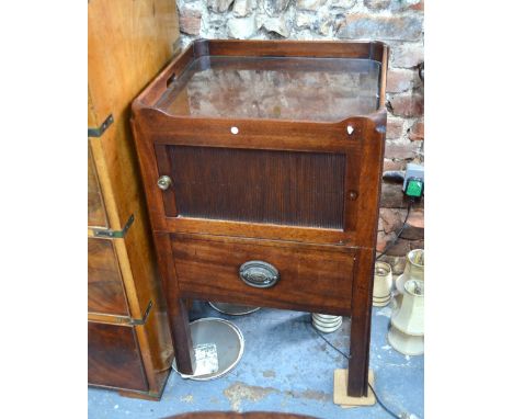 A 19th century mahogany tray top step commode/night stand with tambour door