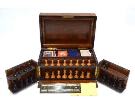 A Victorian burr walnut games compendium with Staunton pattern chess men, Thomas De La Rue playing cards, Gibson (USA) playin