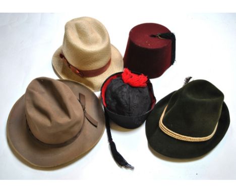 Eight vintage gentlemen's hats to include a Stetson, a fez, a traditional Austrian hat, a mortar-board, a Chinese hat and oth