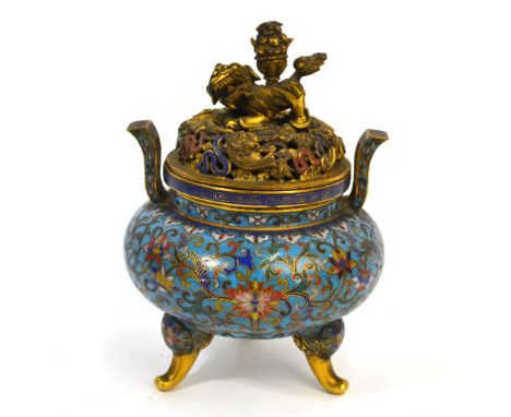 A Chinese Cloisonne enamel incense burner with pierced domed cover and Buddhistic Lion finial, decorated on the typical turqu
