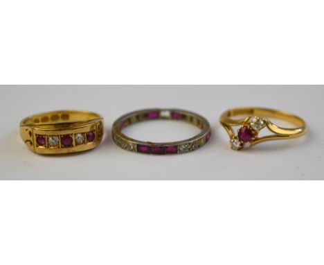 Three ruby and diamond set rings including three stone crossover, five stone, and a full eternity ring set with three rubies 