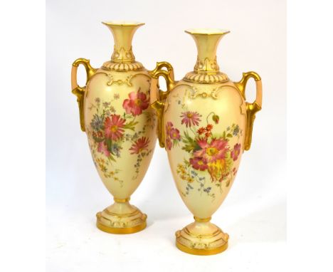A pair of Royal Worcester blush ground twin handle vases with floral decoration, puce marks, date cypher 1903, shape 2256, 31