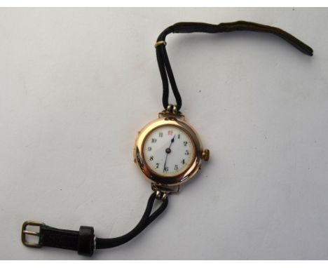 A lady's vintage Swiss 9ct gold wristwatch London import 1911, decorative enamel dial and moire and leather strap