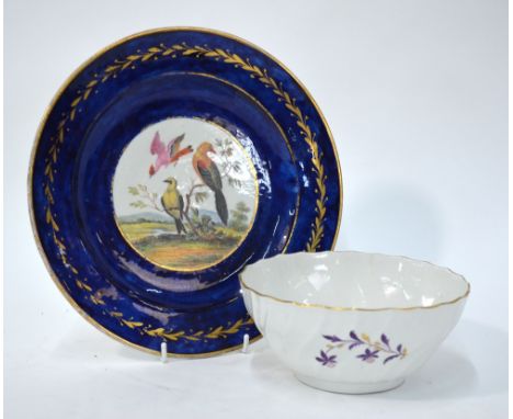 An English 18th century porcelain cabinet plate, royal blue ground with a gilt foliate band, the centre painted with exotic b