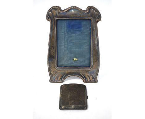 An Art Nouveau silver photograph frame, Boots Pure Drug Company, Birmingham 1918, 21 x 14 cm to/w an engine-turned cigarette 