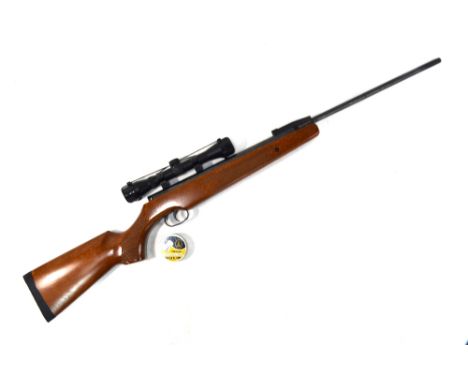 A Remington Express .177 air rifle with 4 x 32 telescopic sight, to/w a tin of pellets