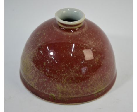 A mottled peachbloom, Chinese brushwasher of typical circular and beehive form; 12.5cm diameter, underglaze blue Kangxi six-c