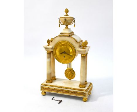 F Baetens, 23 Gerrards Street, London, a good ormolu mounted white marble portico clock circa 1820,  surmounted by a swag hun