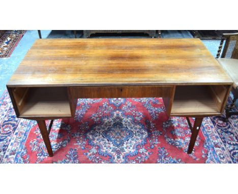 A mid century Danish rosewood desk commissioned in the 1960's, the rectangular top with five frieze drawers to one side oppos