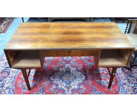 A mid century Danish rosewood desk commissioned in the 1960's, the rectangular top with five frieze drawers to one side oppos