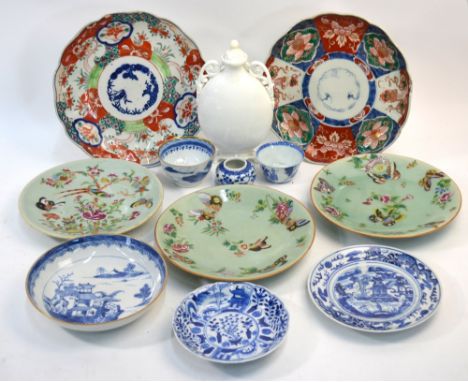 Twelve pieces of porcelain, comprising: a white monochrome vase and cover; two Japanese Imari dishes; three celadon ground fa