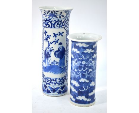 Two cylindrical blue and white, Chinese vases, comprising: one decorated with dragons and Kangxi four-character mark, 15cm hi