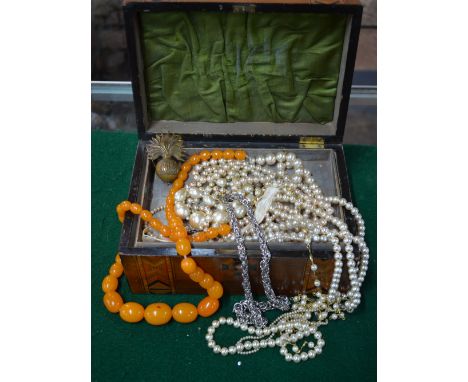 Two boxes of mixed vintage and later jewellery including simulated pearls, simulated amber, various buckles, necklaces, brace