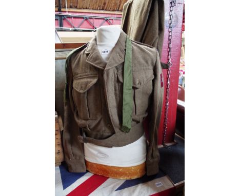 A 1949 pattern battledress blouse size 8, dated 1952 together with size 11 trousers and tie, Royal signals insignia