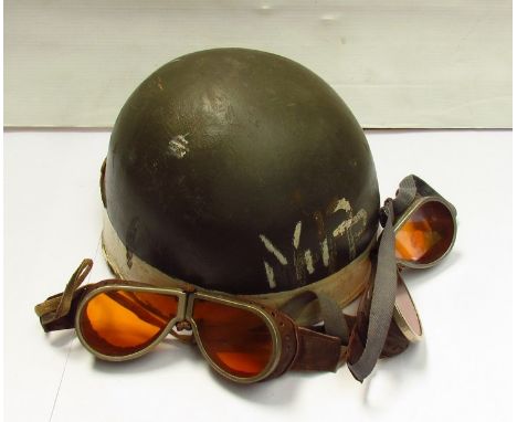 A 1950's British motorcycle dispatch rider's helmet together with tinted goggles, helmet dated 1951  