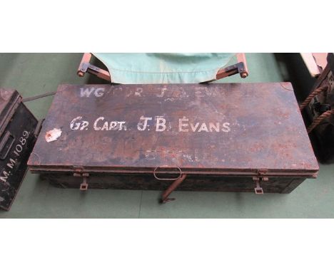 A military tin trunk with lettering "GP. CAPT J.B. EVANS"