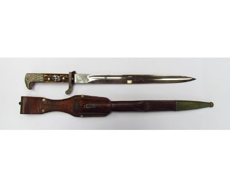 A Third Reich era German Police bayonet with antler grips, eagle head pommel. Alexander Cappel makers mark, brown leather sca
