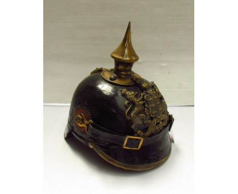 A German Pickelhaube style helmet with brass spike over Wurtemberg badge "FURCHTLOS UND TREW", later strap with liner
