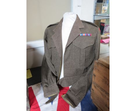 A WWII British Battledress blouse dated 1943, with Royal Engineers insignia 