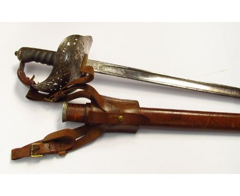 An 1897 pattern officer's sword by Wilkinson, with engraved blade and George V mark, basket hilt with shagreen grips, leather