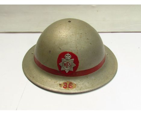 A WWII Norfolk Fire Service helmet with metallic paint red band and applied badge No. 36 