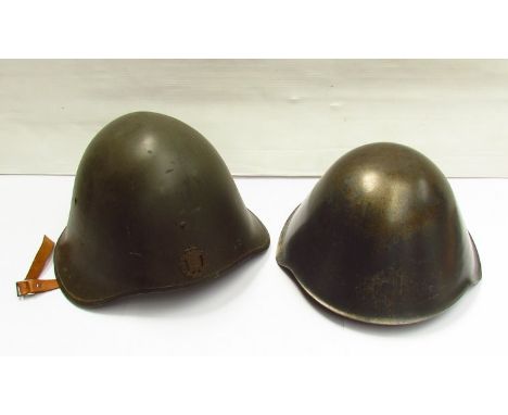 A Danish helmet and a Swiss helmet with camouflage cover (2) 