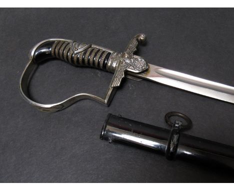 A Third Reich era German Army officer's dove-head sword with stirrup hilt bearing swastika pommel, Bakelite ribbed grips with