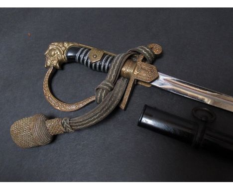 A Third Reich era German Army officer's Zeiten pattern cavalry sword by Eickhorn Solingen with brass lion-form pommel linking