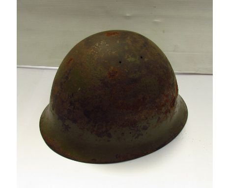 A WWII Japanese helmet with liner  