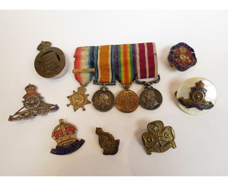 A quantity of military badges including "On War Service 1915" Ordnance, silver Artillery badge (a/f), and Mons Star / Meritor